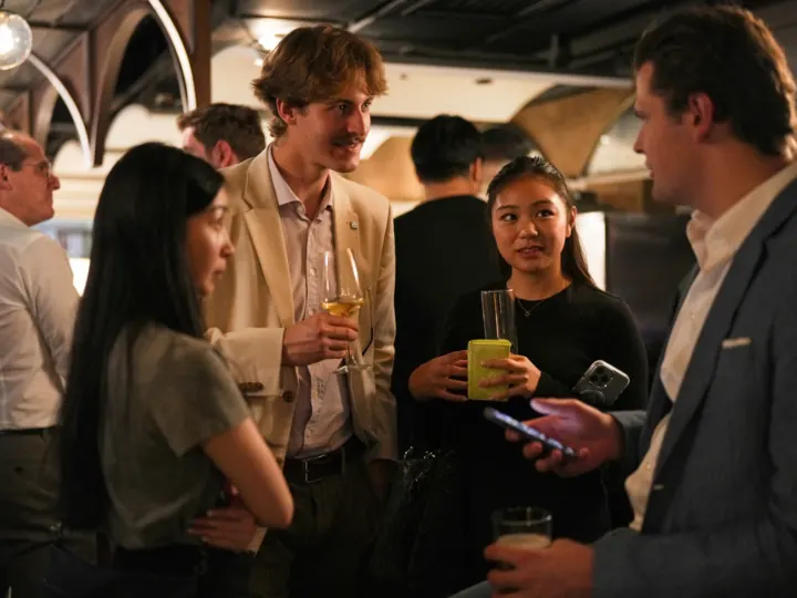 Finoverse guests networking at an evening event