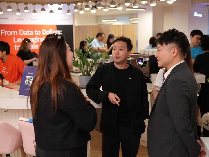 Guests talking in the FinoverseAI showroom